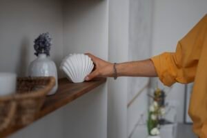 interior designer arranging decorations home