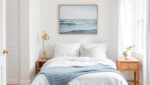 Coastal Bedroom Ideas: 7 Do's and Don'ts for a Calm Beach-House Feel 11 Coastal bedroom with white linen bedding, soft blue throw, jute rug and rattan pendant lamp